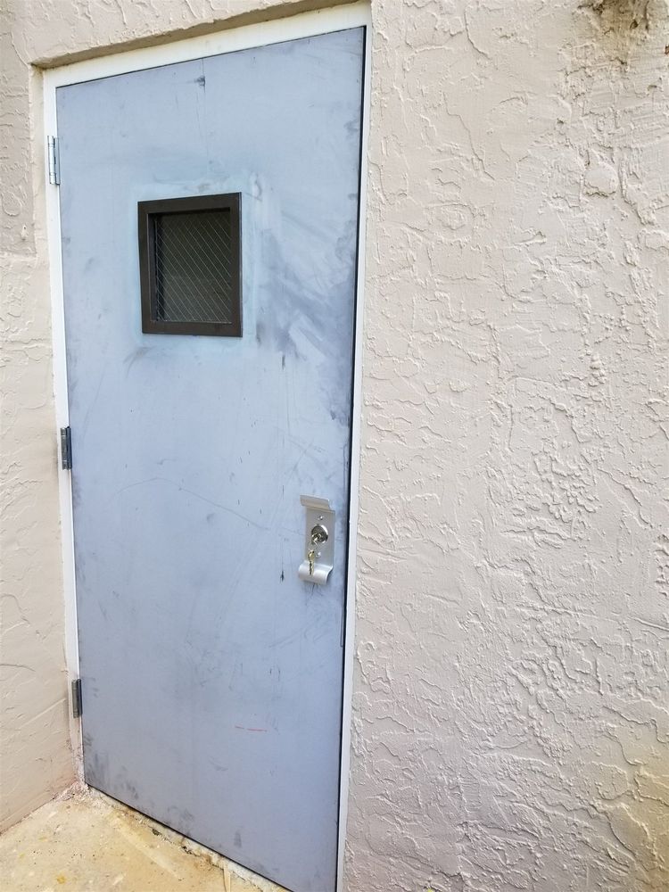 Finished exterior steel door with vision lite in the same opening