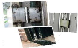 Broken commercial door hinge and pivot hardware causing a sagging door