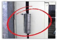 Failed butt hinge on a commercial door, replaced with a continuous hinge