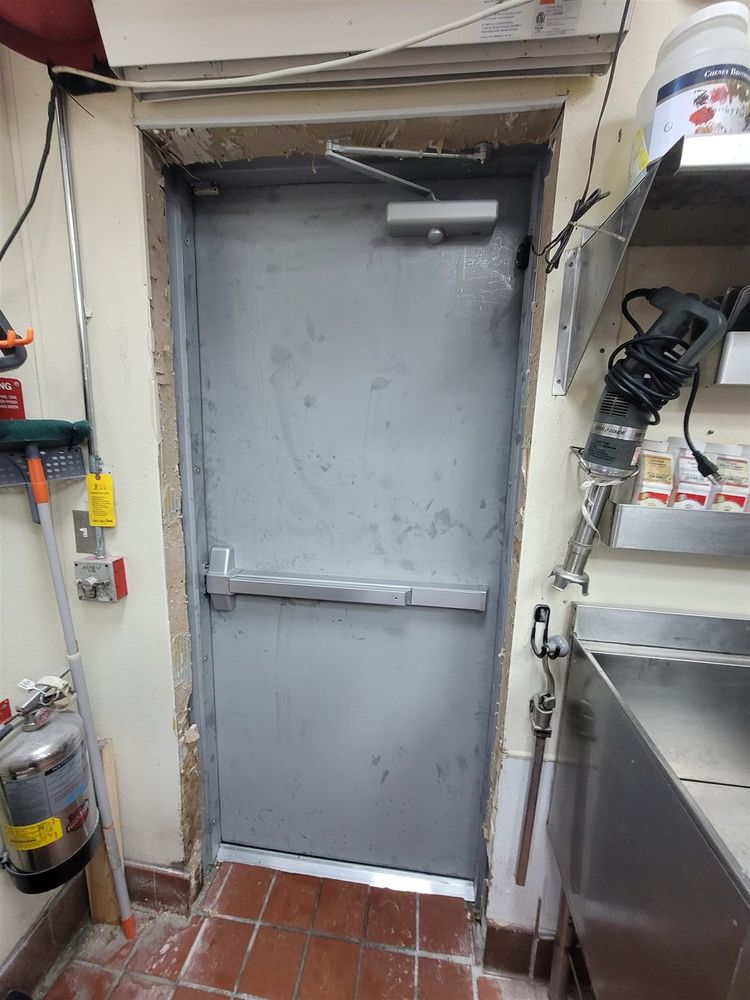 Kitchen back steel door with panic bar and closer