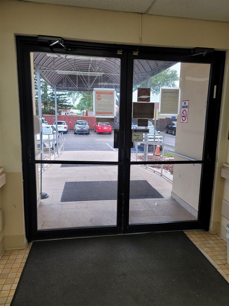 Black aluminum storefront doors at a business entrance