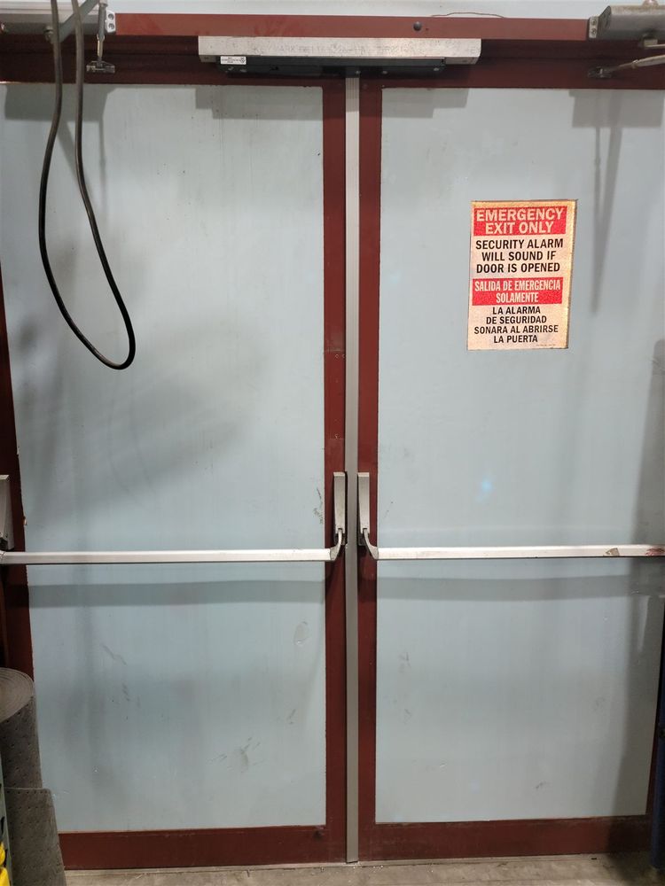 Gray aluminum door pair with panic bars