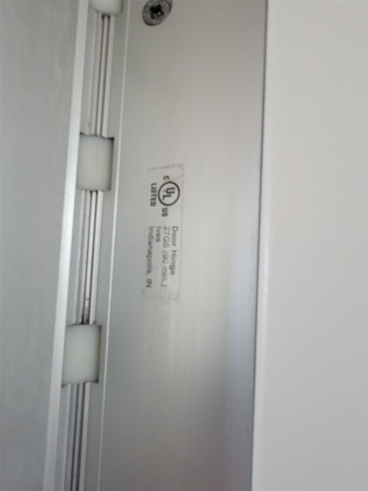 Full-height continuous hinge installed on a commercial steel door frame