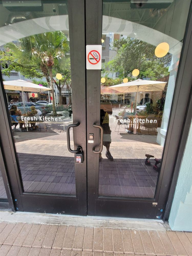Bronze storefront door pair hung square in the frame