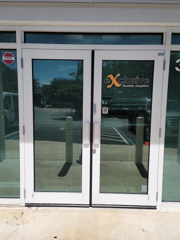 Clear anodized aluminum storefront doors at an office entrance