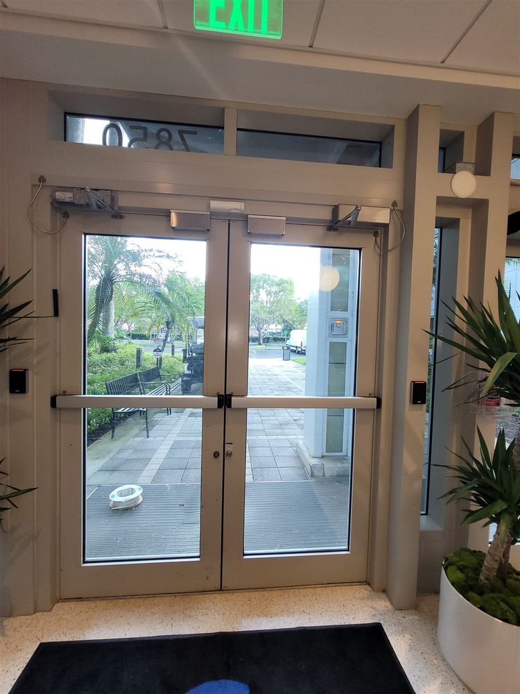 Interior view of aluminum storefront double doors with exit hardware